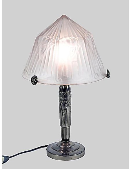 Art Deco table lamp with mushroom-shaped glass shade on a silver-bronze base, illuminated